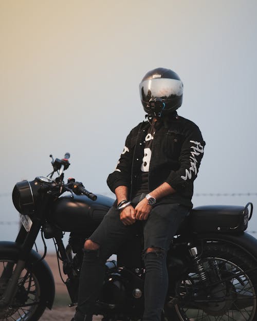 Man in Helmet Sitting on Motorbike