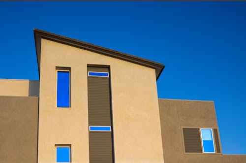 Low Angle Shot of a Residential Building under a Blue Sky