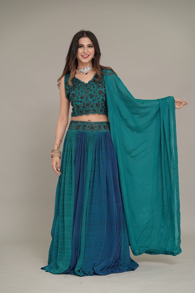 Young Woman In Traditional Dress Posing In Studio 