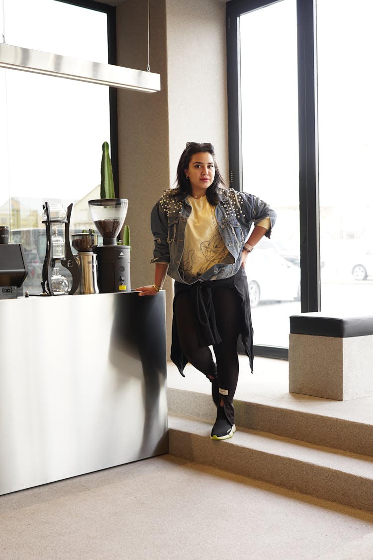 Woman Posing On Stairs In Room