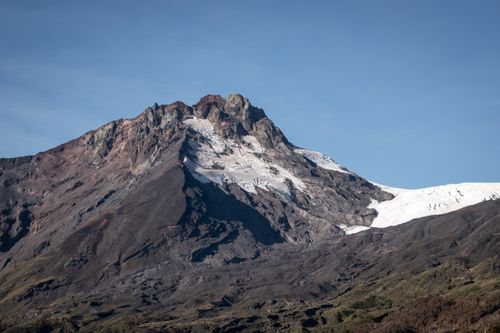 Free Breathtaking view of a snow-capped mountain under a clear blue sky, perfect for nature enthusiasts. Stock Photo