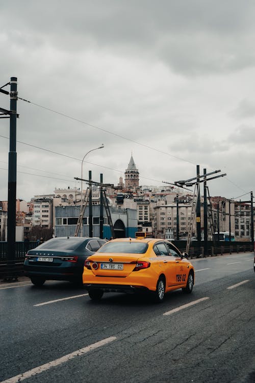 View of Cars on the Street and the Galata Tower in the Background, Istanbul, Turkey 