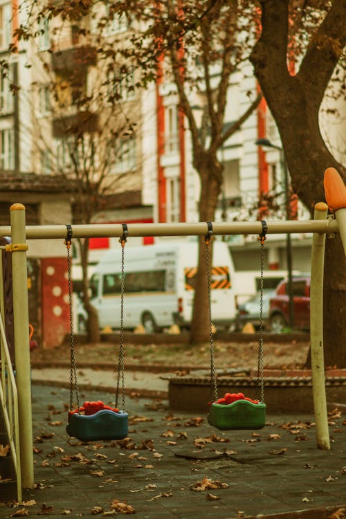 Empty Swings on a Playground 