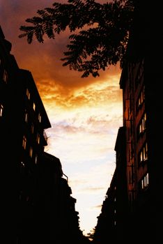 Striking sunset silhouette of Eskişehir buildings with warm sky tones.