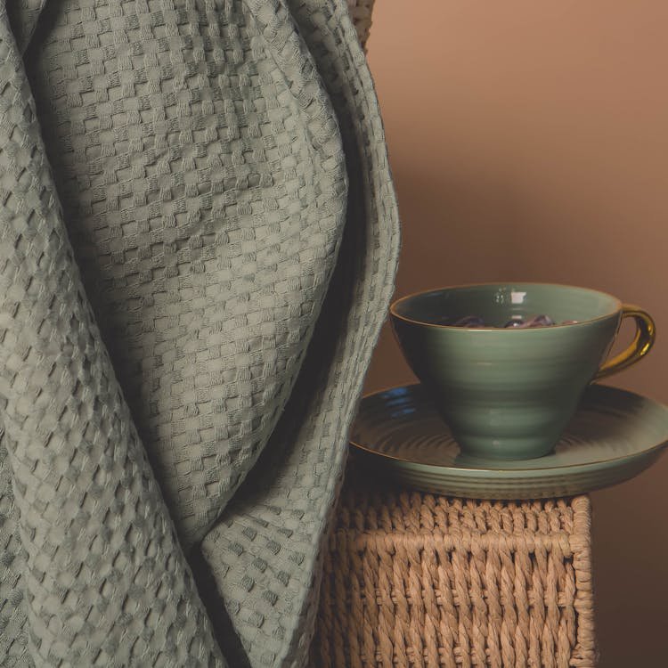 Cup On Straw Stand In Home Interior