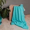 Teal woven throw by Dmitriy Steinke on Pexels
