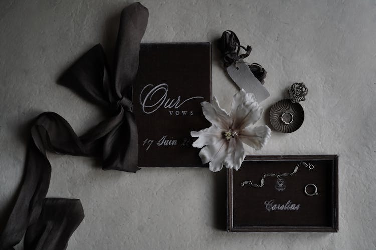 Decorations, Jewelry And A Booklet With Wedding Vows