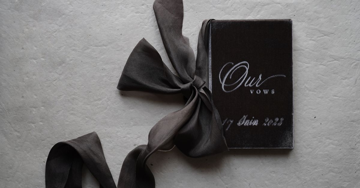 A Booklet with Wedding Vows and a Ribbon · Free Stock Photo