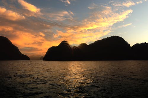 Silhouetted Islands on the Sea at Sunset 