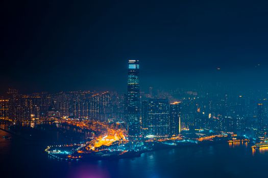 Breathtaking aerial view of a modern city skyline illuminated at night, capturing the vibrant urban life.