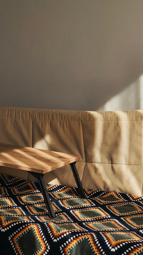 Free Blanket on a Sofa in Sunlight Stock Photo