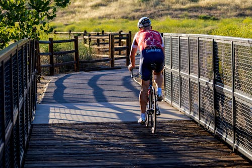 Photo of a Cyclist on a Bicycle Path