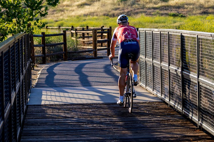 Photo Of A Cyclist On A Bicycle Path