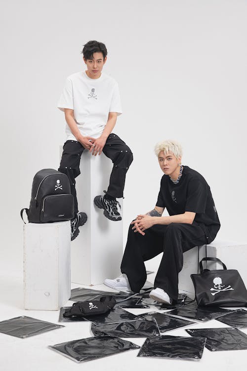 Men in Sportswear and Accessories Posing in White Studio