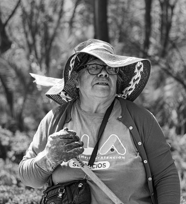 Candid Portrait Of An Elderly Woman Working In The Garden 