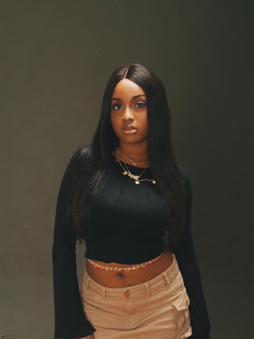 Studio Shot of a Young Brunette in a Trendy Outfit 