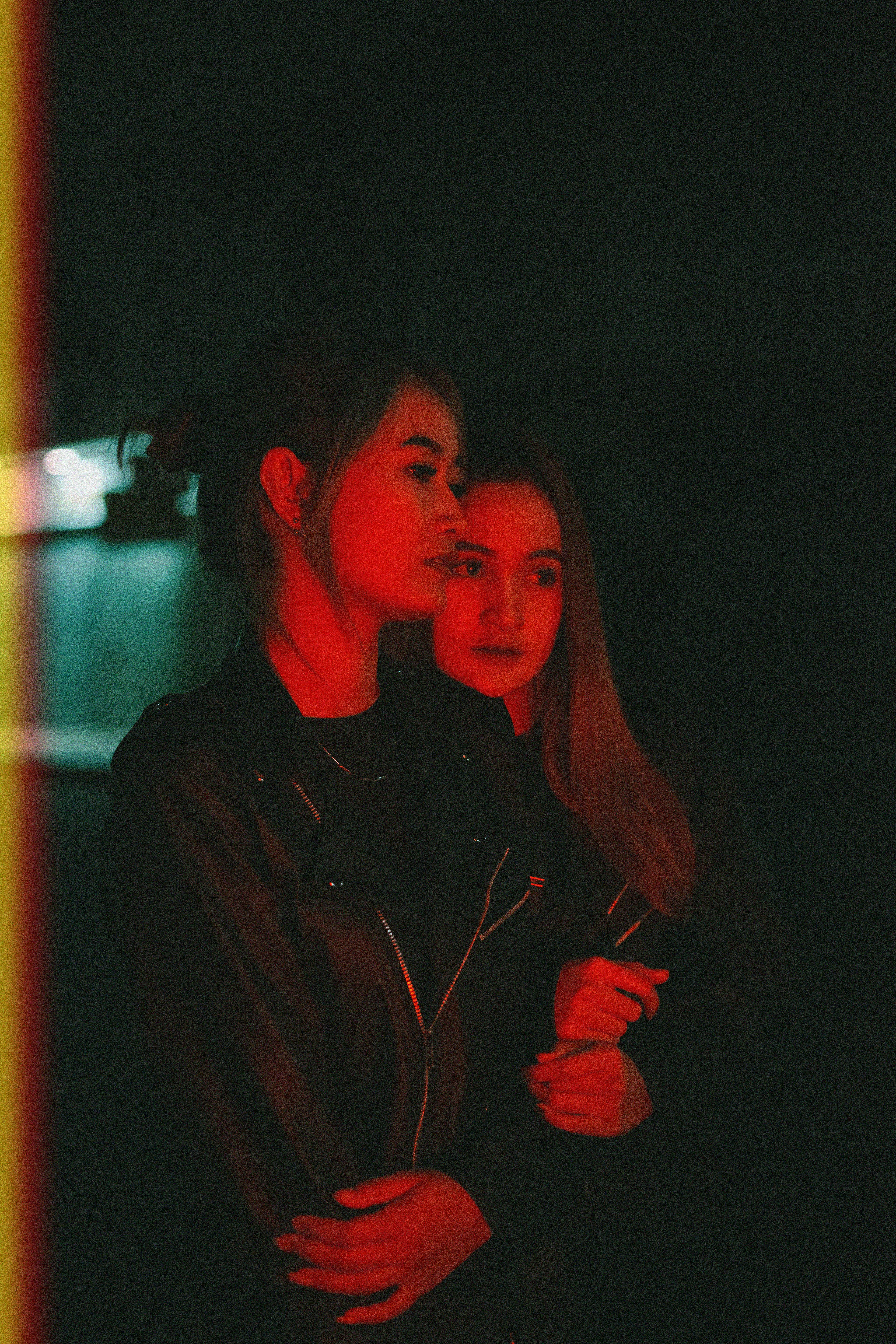 Two Women In Black Jackets Standing Next To Each Other · Free Stock Photo