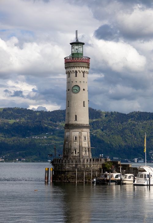 Free Scenic view of Lindau Lighthouse on Lake Constance with cloudy skies. Stock Photo
