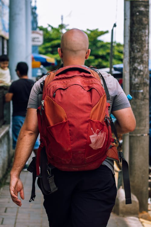 Bald Man with Backpack