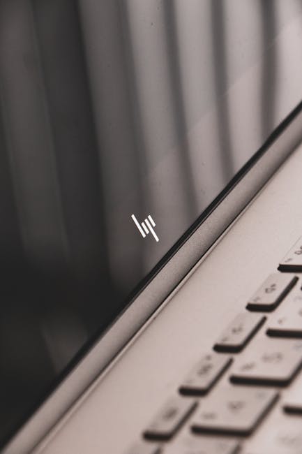 Detailed view of a sleek modern laptop showing a close-up of the screen and keyboard design.