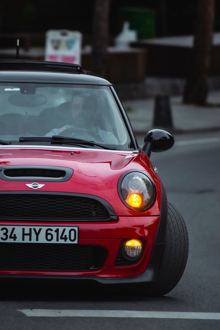 Man Driving Red Mini Morris