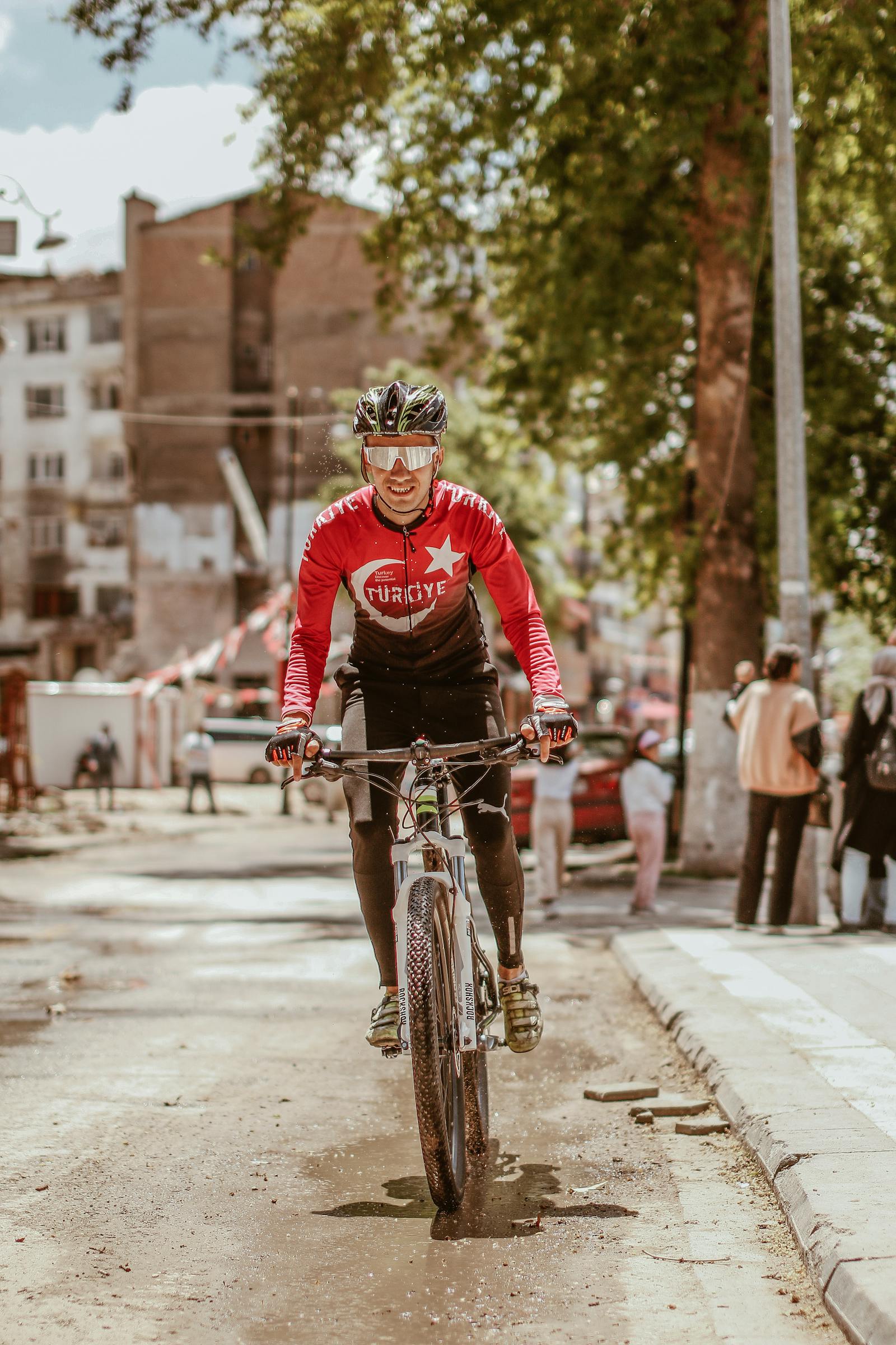 A Male Cyclist Riding a Bike · Free Stock Photo