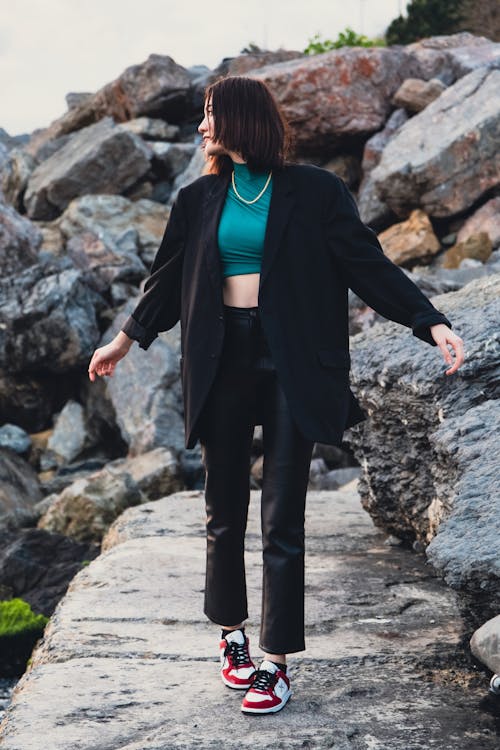A Woman Walking Down Trough the Rocks