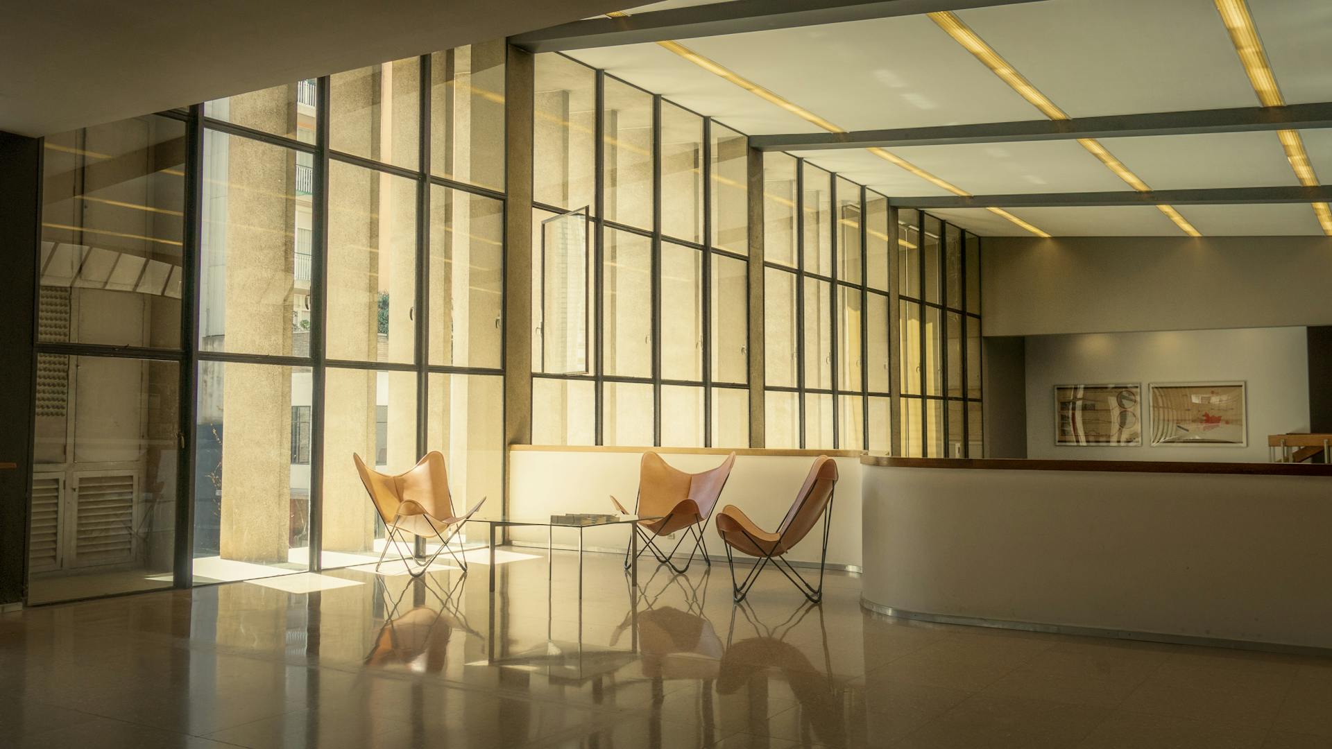 Stylish modern lobby with natural light and minimalist design in Barcelona, Spain.