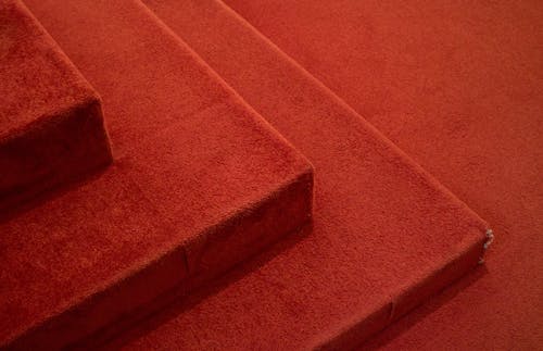 Close-up of Steps Covered with Red Carpet 