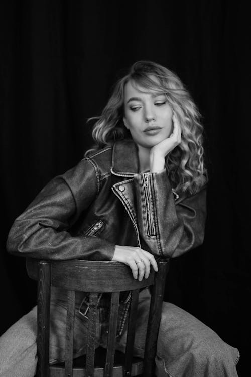 Free Young Woman in a Leather Jacket Posing in Studio  Stock Photo