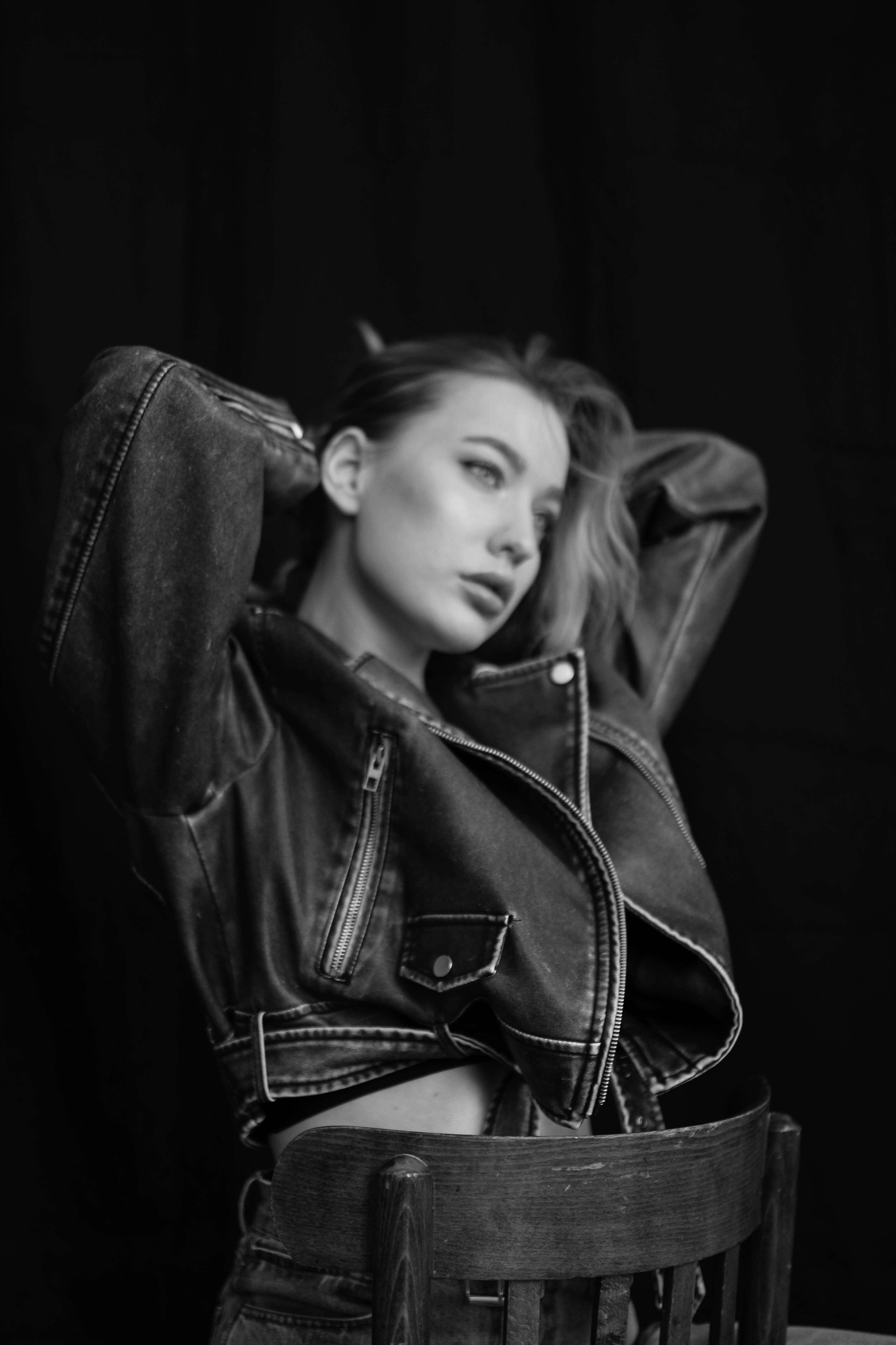 Young Woman in a Leather Jacket Posing in Studio · Free Stock Photo