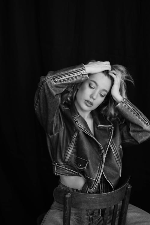 Young Woman in a Leather Jacket Posing in Studio 