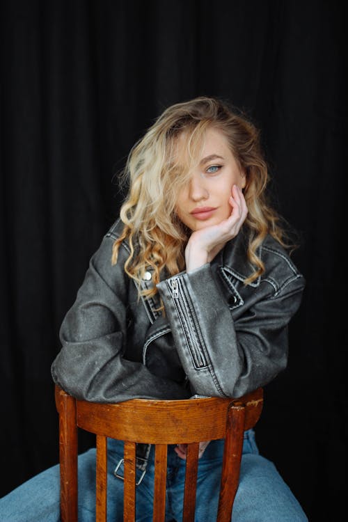 Portrait of a Young Attractive Woman in a Leather Jacket