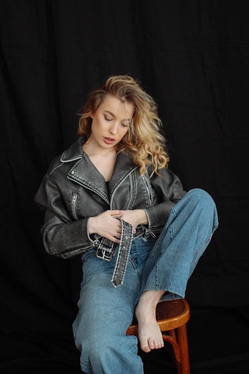 Young Woman in a Leather Jacket Posing in Studio 
