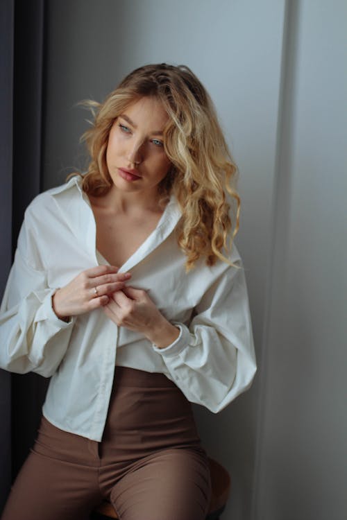 Young Woman in an Elegant Outfit Posing in Studio 