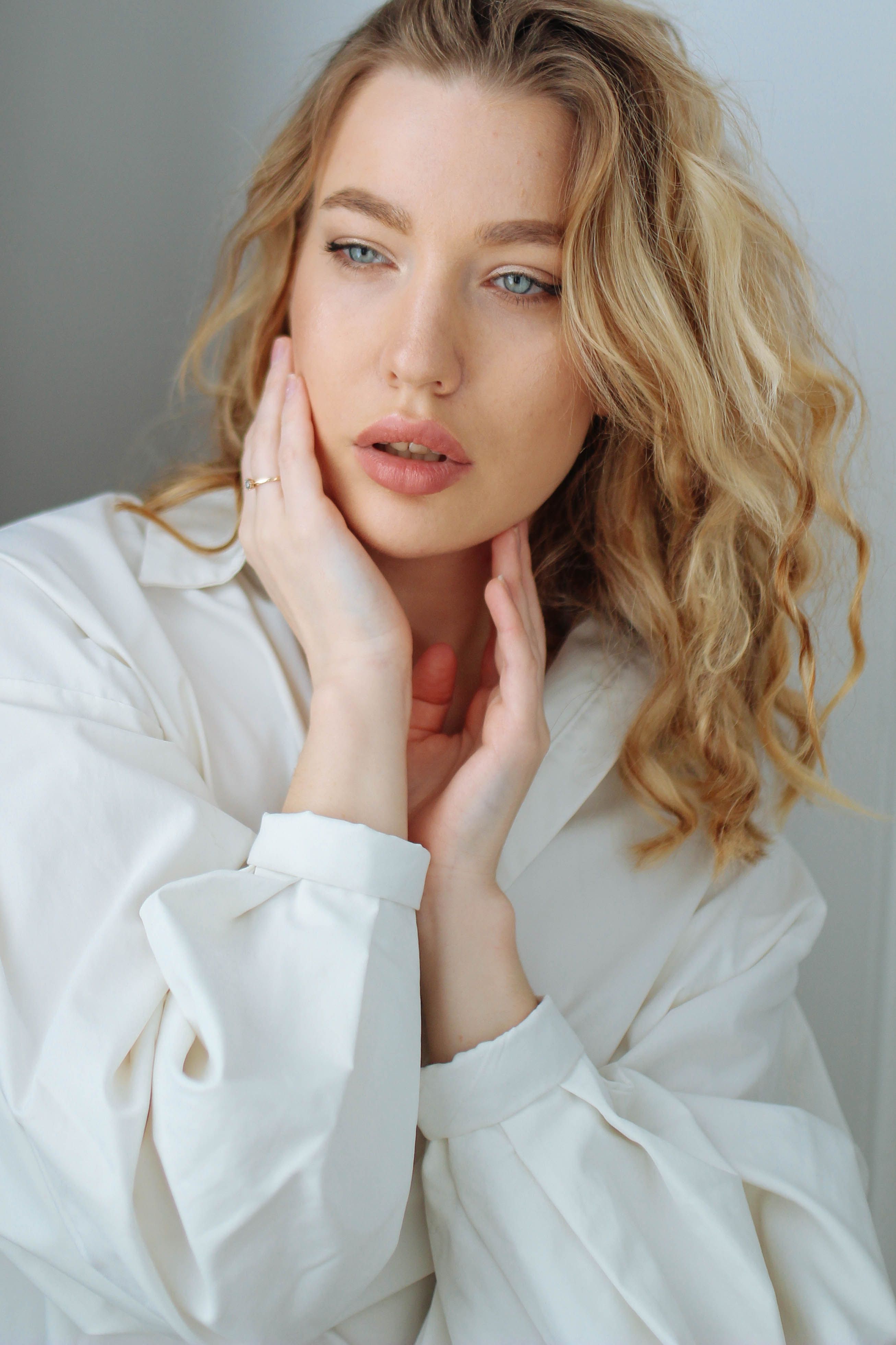 Portrait of a Beautiful Woman in a White Shirt · Free Stock Photo