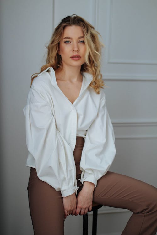 Model in White Shirt and Brown Pants