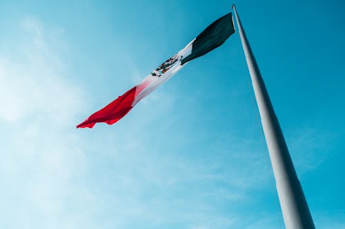 Free stock photo of bandera, blue sky, mexico Stock Photo