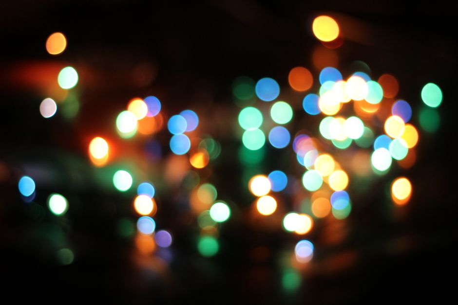 Colorful bokeh lights captured at night, creating a festive and magical atmosphere.