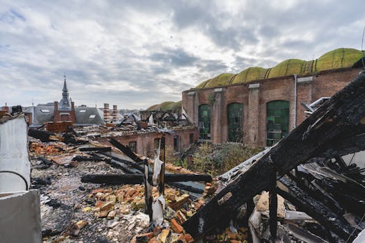 Explore the eerie ruins of an abandoned factory with crumbling architecture and urban decay.
