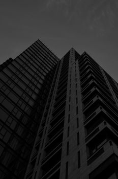Low angle view of a skyscraper showcasing contemporary brutalist architecture.