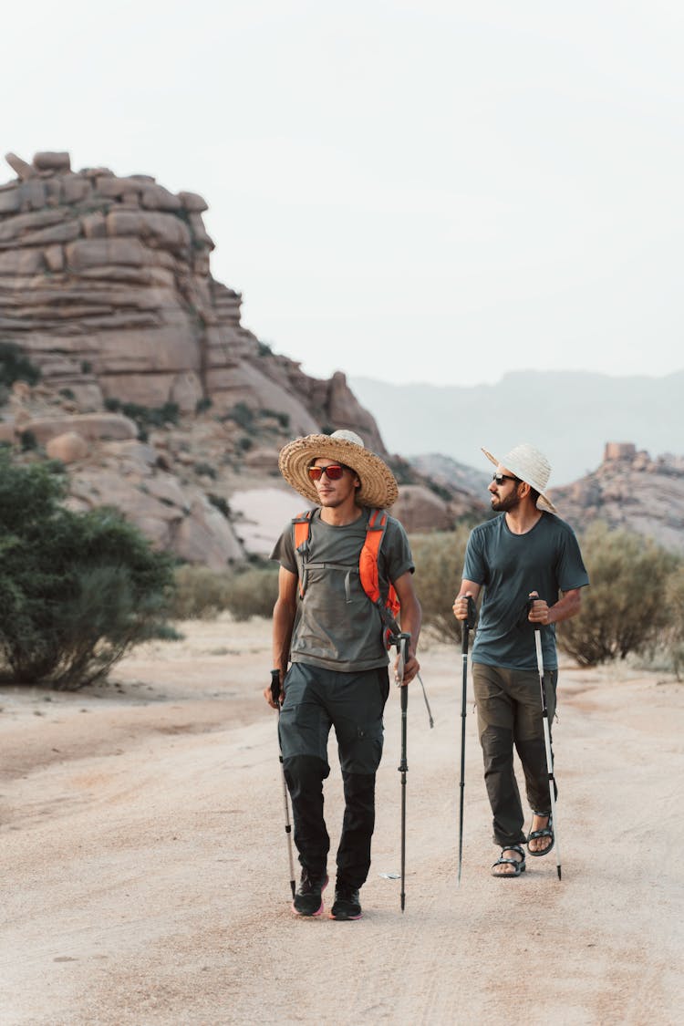 Men Hiking On Desert