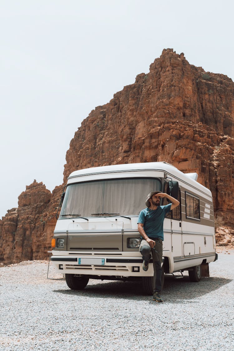 Man Posing By Camper