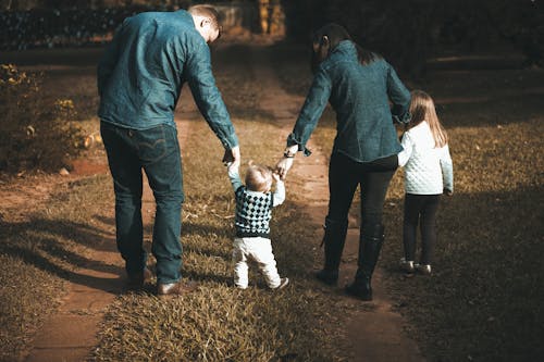 Free Family Walking on Path Stock Photo