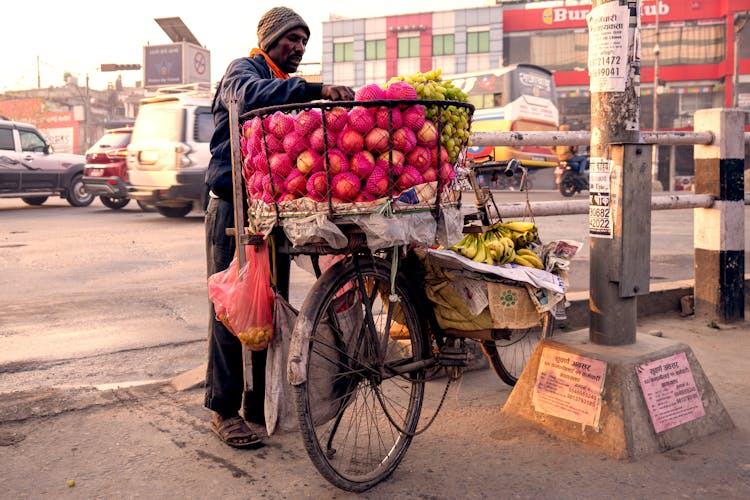 Man With Merchandise On A Bicycle 