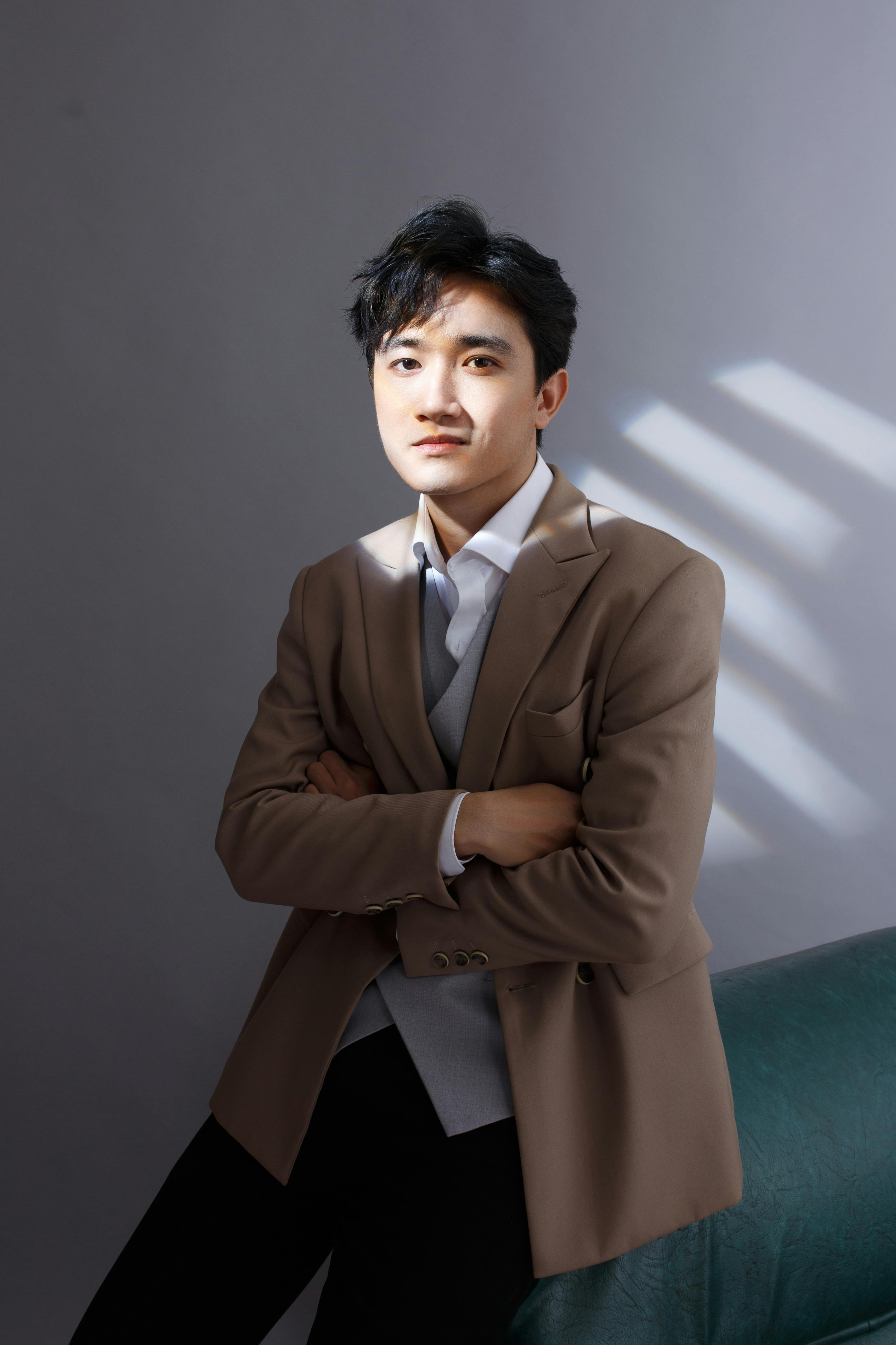 Portrait of a stylish man in a suit with artistic lighting creating a modern look.