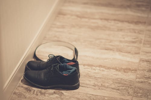 Black Leather Shoes on Floor