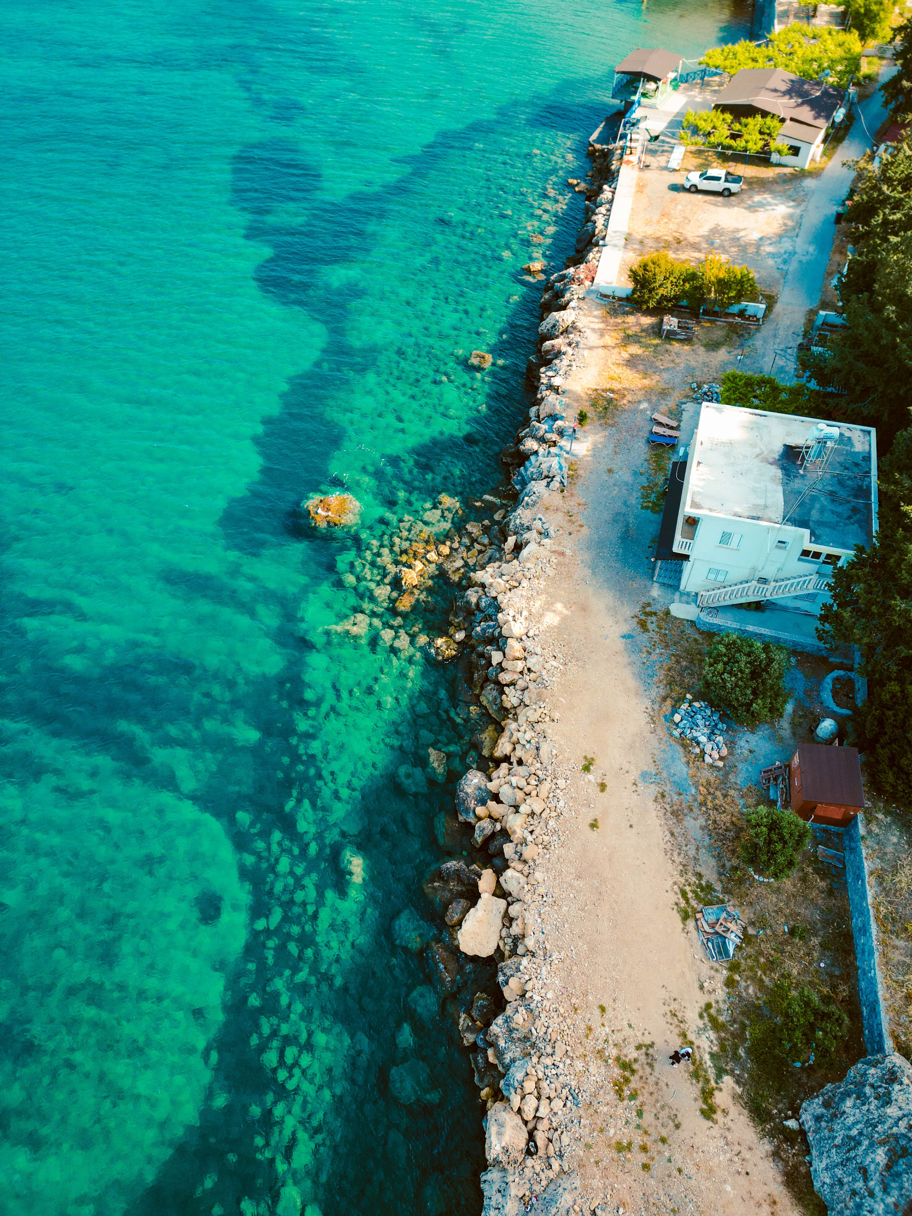 A stunning aerial shot of the coastline in Yeşilırmak, showcasing the clear waters and rocky shore.