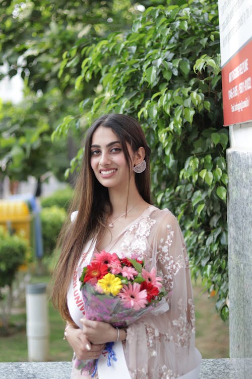 Beautiful Woman with a Bouquet of Flowers 