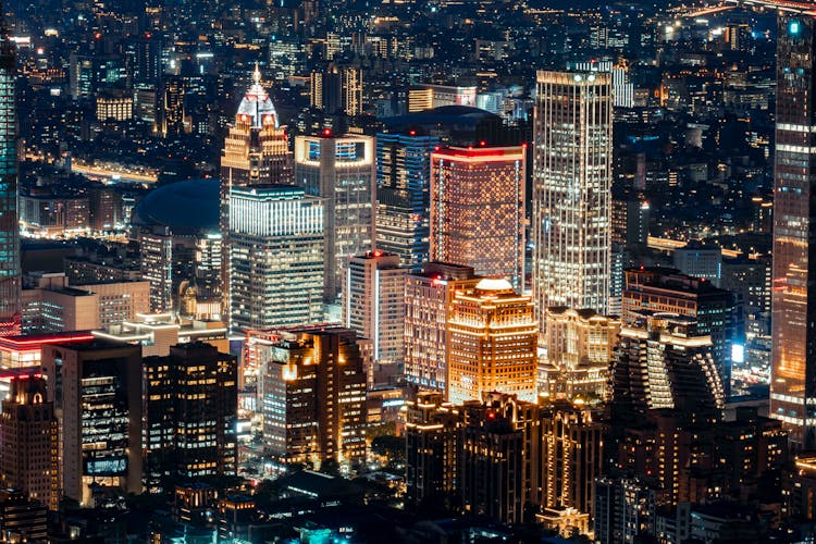 Illuminated Buildings In City At Night